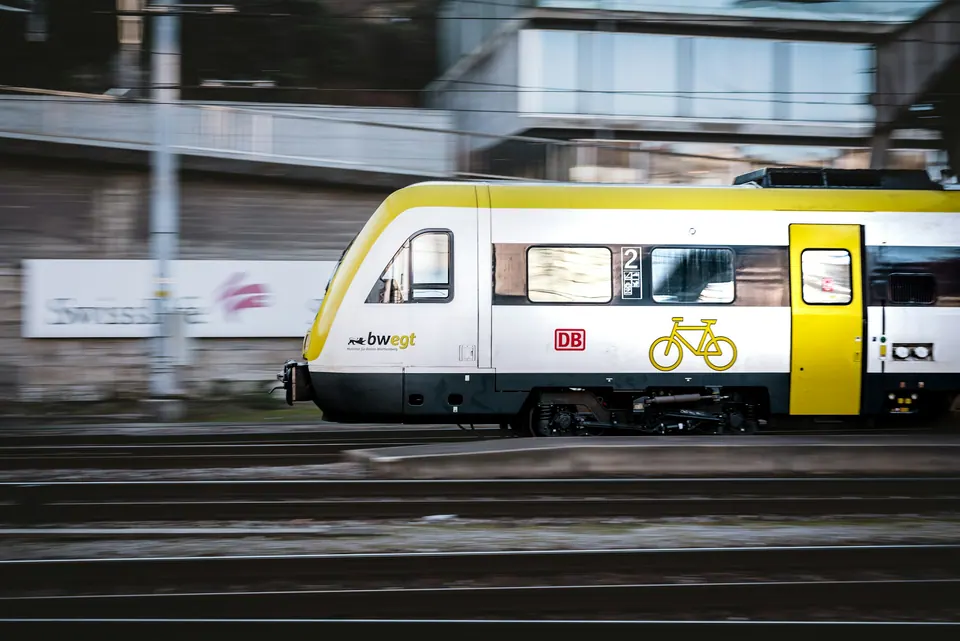A white and yellow Deutsche Bahn regional train passing Schaffhausen station