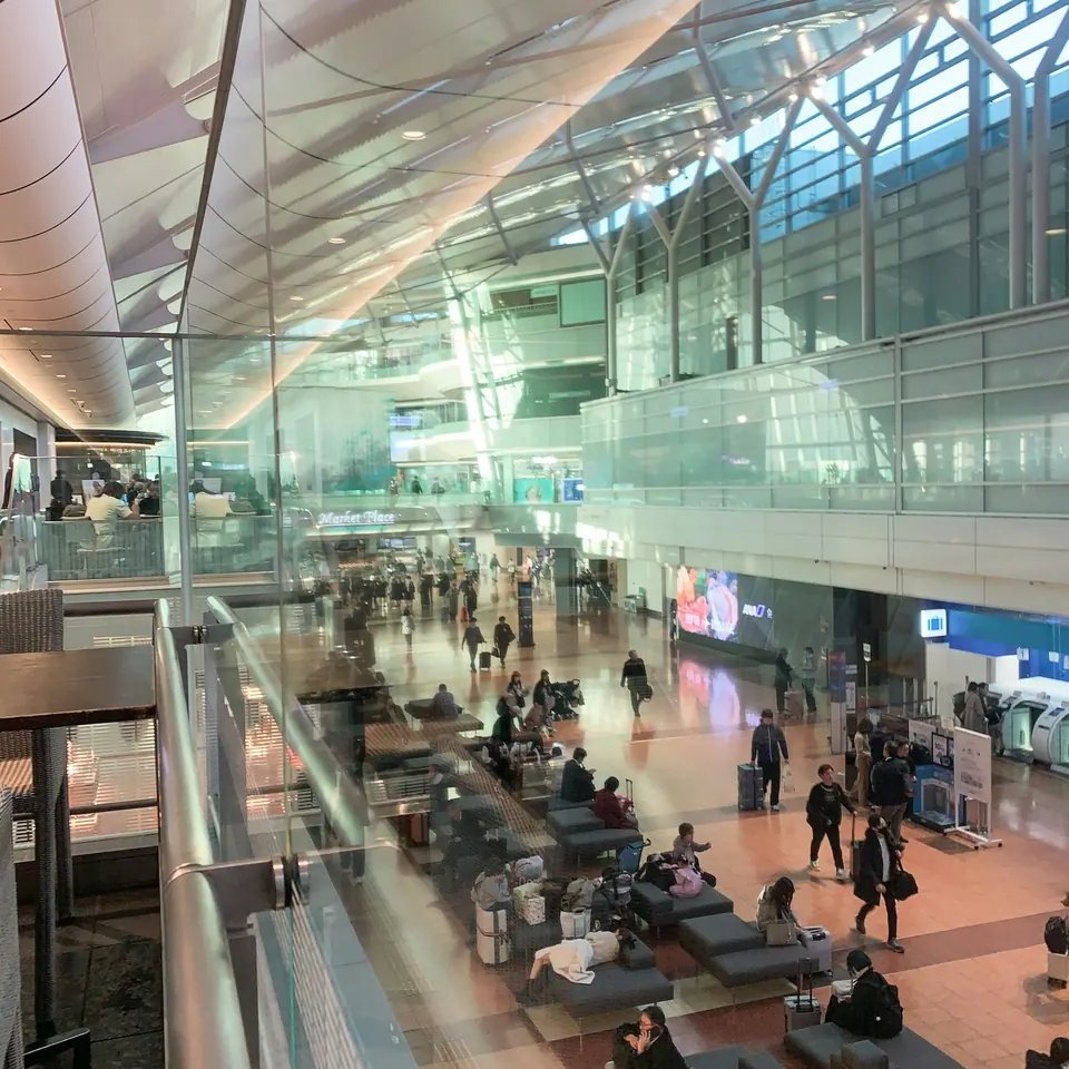 Passengers and waiting areas inside Terminal 1 at Tokyo Haneda Airport